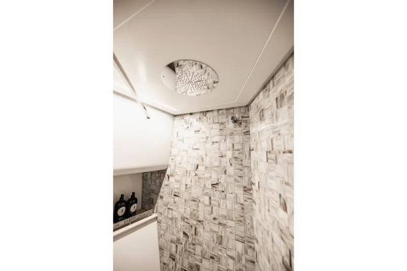 Slide: The Image of Luxurious bathroom interior of 2021 Pershing 62 yacht with elegant tile design. - 109