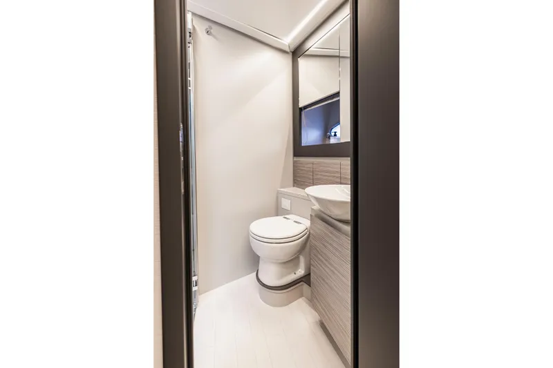 Slide: The Image of Modern bathroom interior on 2021 Pershing 62 yacht, featuring sleek design and fixtures. - 114