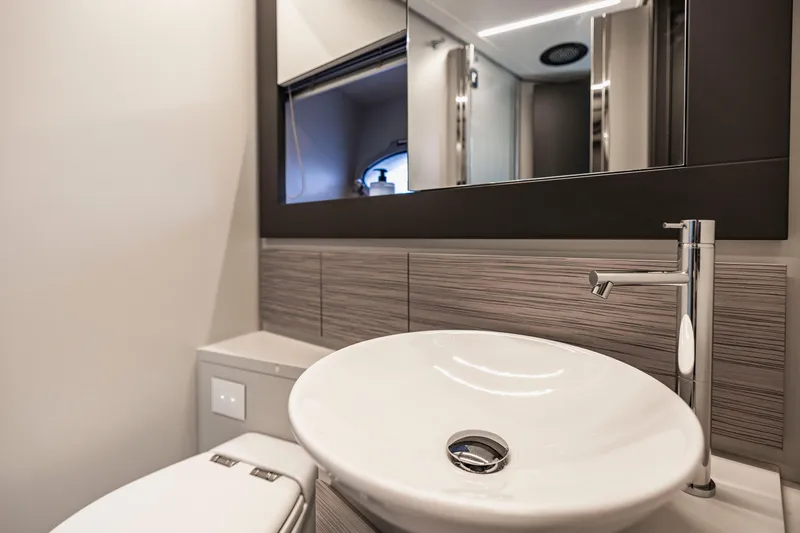 Slide: The Image of Luxurious bathroom interior of 2021 Pershing 62 yacht with modern sink and fixtures. - 115