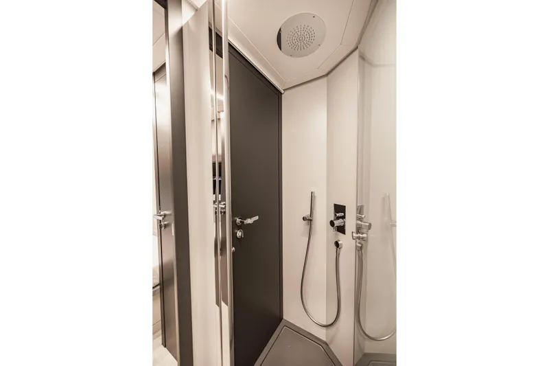 Slide: The Image of Modern shower area in 2021 Pershing 62 yacht, featuring sleek design and fixtures. - 118