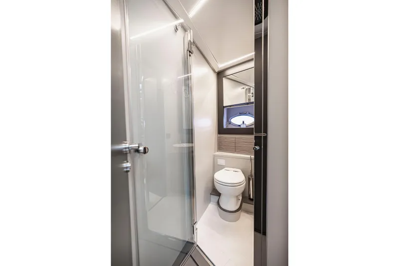 Slide: The Image of Luxurious bathroom in 2021 Pershing 62 yacht, featuring modern fixtures and sleek design. - 122