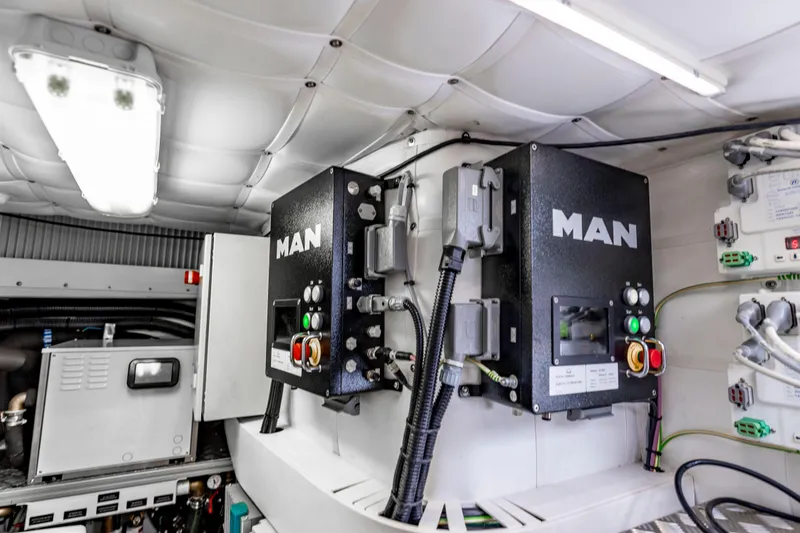 Slide: The Image of Engine room of 2021 Pershing 62 yacht featuring MAN equipment and control systems. - 129