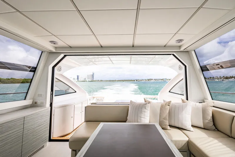 Slide: The Image of Luxurious interior of 2021 Pershing 62 yacht with ocean view and elegant seating. - 13