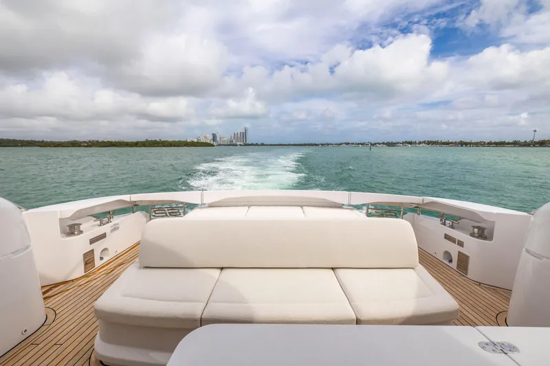 Slide: The Image of Luxury Pershing 62 yacht cruising on open water, 2021 model, with scenic ocean view. - 17