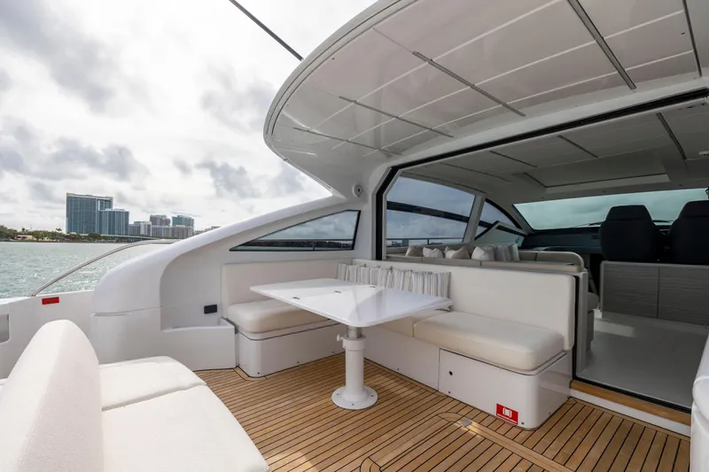 Slide: The Image of Luxurious 2021 Pershing 62 yacht interior with elegant seating and ocean view. - 35
