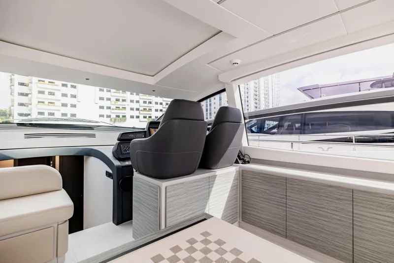 Slide: The Image of Luxurious interior of 2021 Pershing 62 yacht with modern seating and sleek design. - 40