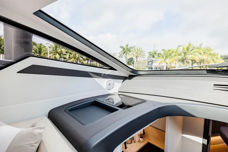 Slide: The Image of Interior view of 2021 Pershing 62 yacht with modern design and panoramic windows. - 45
