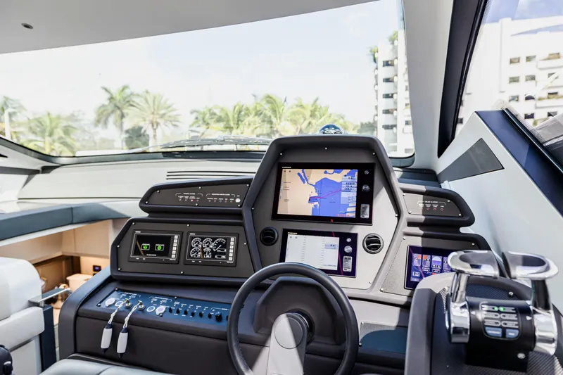 Slide: The Image of Cockpit of 2021 Pershing 62 yacht with advanced navigation systems and controls. - 55