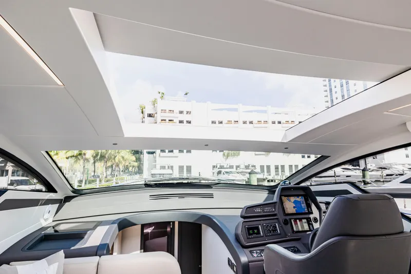Slide: The Image of Interior view of 2021 Pershing 62 yacht cockpit with modern navigation system. - 58