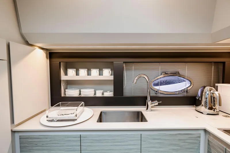 Slide: The Image of Modern kitchen interior on 2021 Pershing 62 yacht with sleek design and stainless steel fixtures. - 65