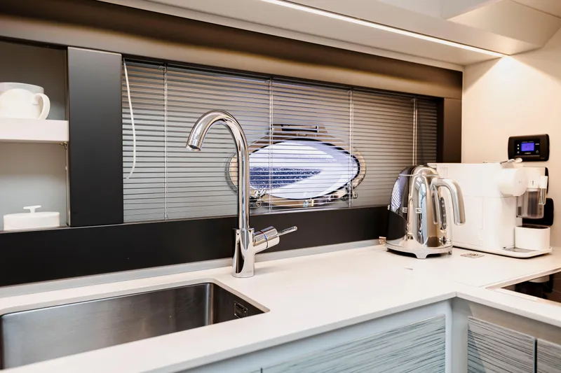 Slide: The Image of Modern kitchen interior on 2021 Pershing 62 yacht with sleek appliances and stylish design. - 67