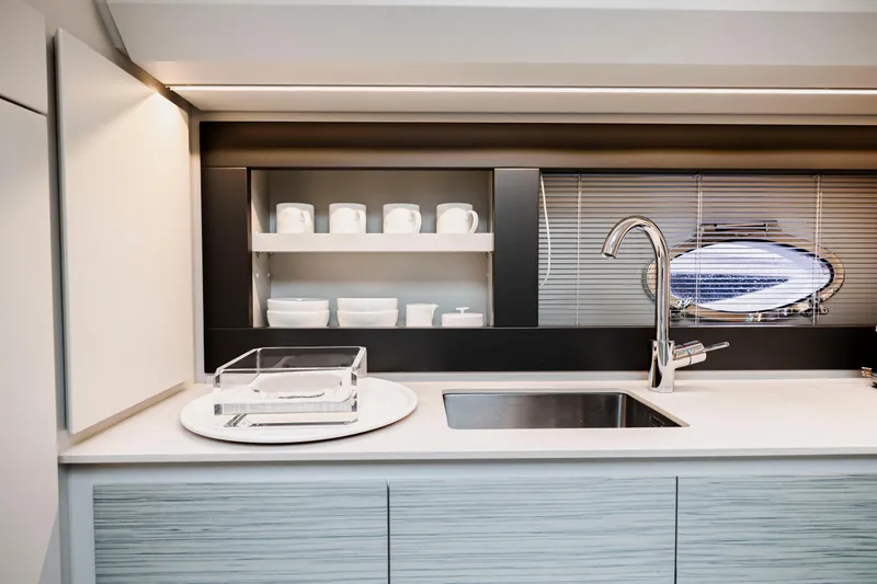 Slide: The Image of Modern kitchen interior of 2021 Pershing 62 yacht with sleek design and stainless steel fixtures. - 68