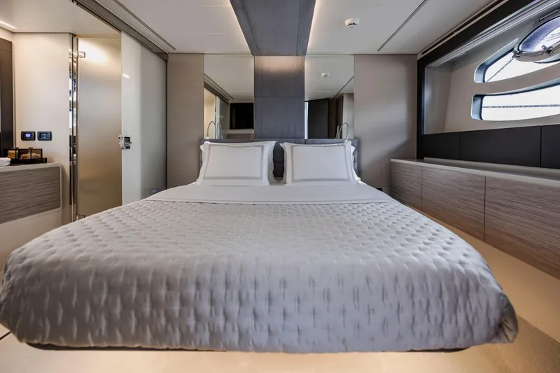 Slide: The Image of Luxurious bedroom interior of 2021 Pershing 62 yacht with modern design and elegant bedding. - 71
