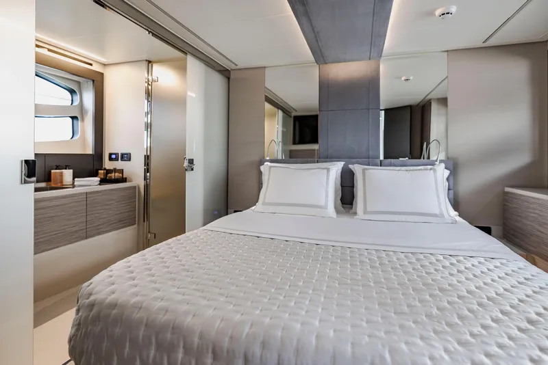 Slide: The Image of Luxurious bedroom interior of 2021 Pershing 62 yacht with modern design and elegant bedding. - 72