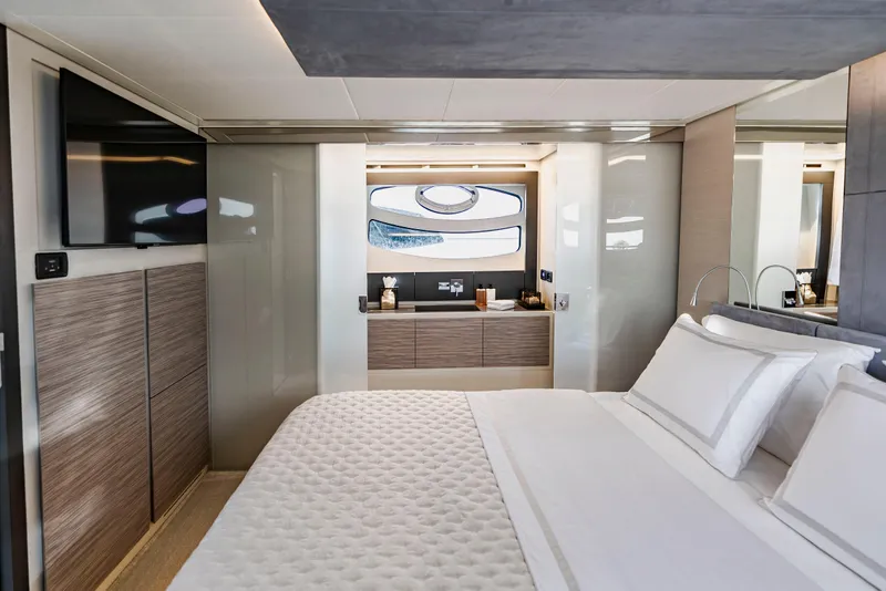 Slide: The Image of Luxurious bedroom interior of 2021 Pershing 62 yacht with modern design and elegant furnishings. - 74