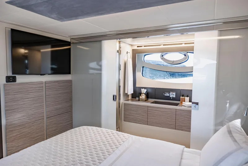Slide: The Image of Luxurious interior of 2021 Pershing 62 yacht featuring modern bedroom and bathroom design. - 75