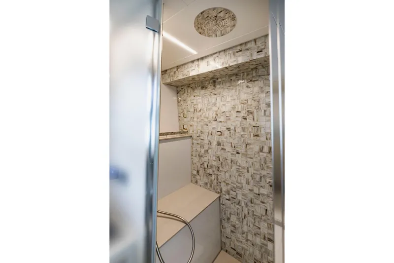 Slide: The Image of Luxurious bathroom interior on 2021 Pershing 62 yacht with modern tile design. - 82