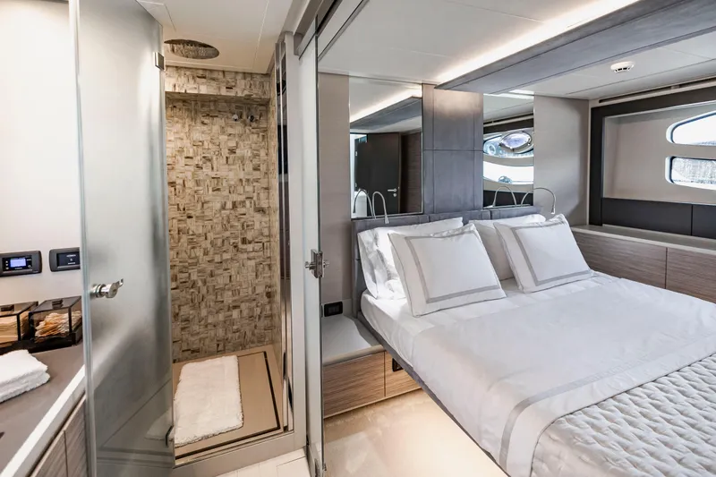 Slide: The Image of Luxurious bedroom and bathroom interior of 2021 Pershing 62 yacht, featuring modern design elements. - 85