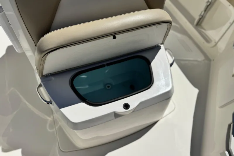 Slide: The Image of 2019 Stingray 206 CC boat seat with built-in storage compartment. - 10