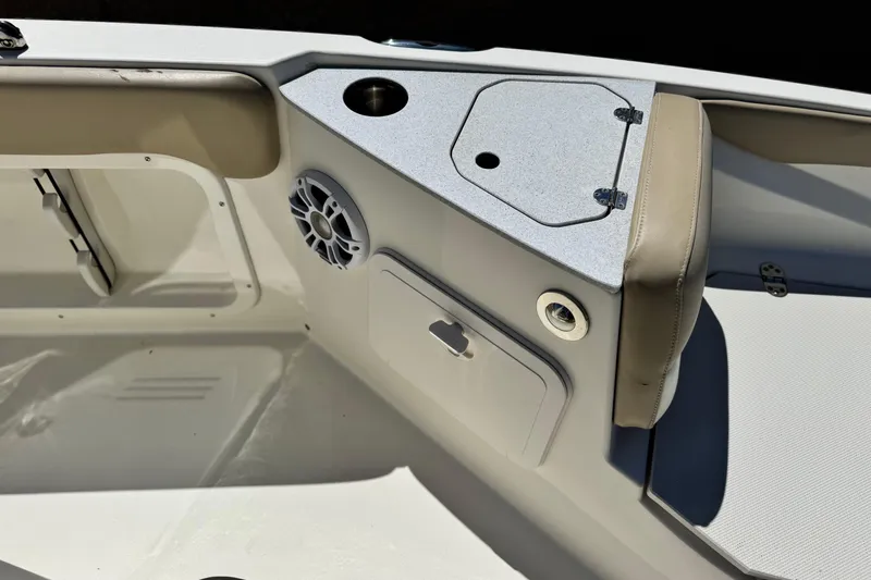 Slide: The Image of Interior of 2019 Stingray 206 CC boat, featuring seating and storage compartments. - 11