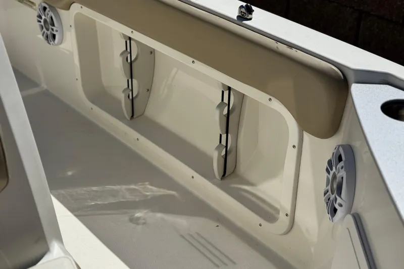Slide: The Image of Interior of a 2019 Stingray 206 CC boat, featuring speakers and storage compartments. - 14