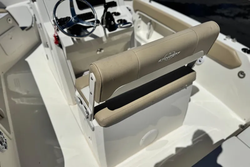 Slide: The Image of 2019 Stingray 206 CC boat interior with steering wheel and seating. - 20