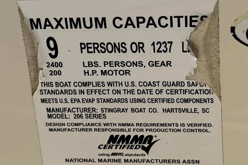 Slide: The Image of 2019 Stingray 206 CC capacity label, 9 persons, 2400 lbs, 200 HP motor compliance. - 29