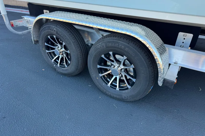 Slide: The Image of Trailer wheels of a 2019 Stingray 206 CC boat on a diamond plate fender. - 31