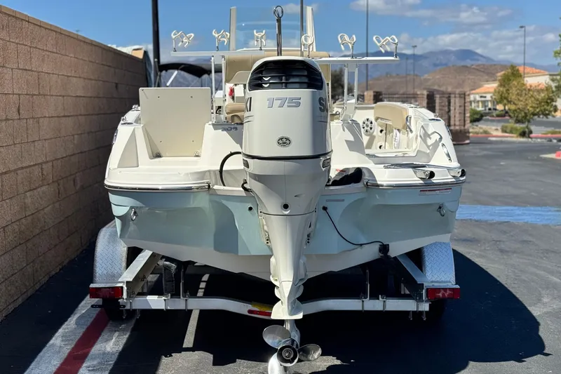 Slide: The Image of 2019 Stingray 206 CC boat with Suzuki 175 outboard motor on trailer. - 4