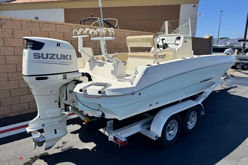 Slide: The Image of 2019 Stingray 206 CC boat with Suzuki outboard motor on trailer. - 5