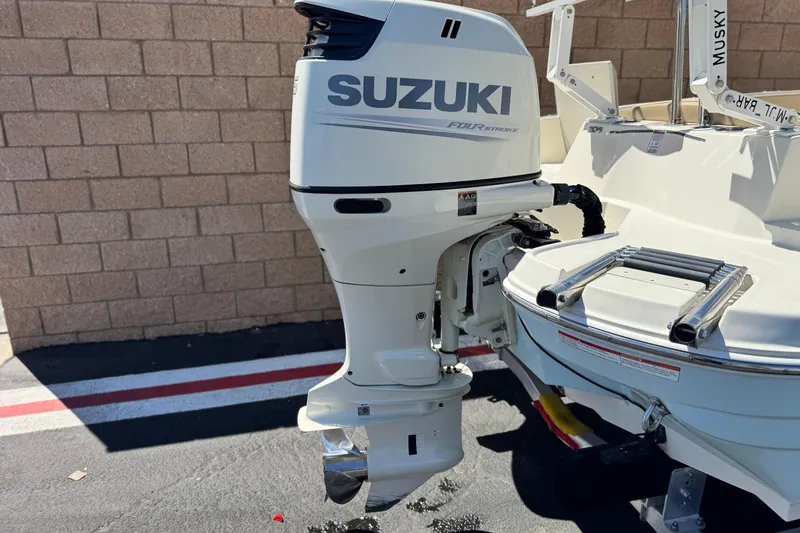 Slide: The Image of 2019 Stingray 206 CC boat with Suzuki four-stroke outboard motor. - 6