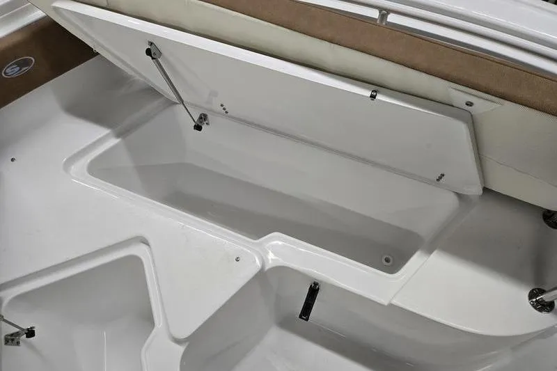 Slide: The Image of 2026 Sea Hunt Ultra 245 SE boat storage compartment with open lid. - 5