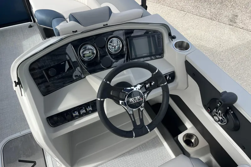 Slide: The Image of 2026 Avalon 2385 LSZ Quad Lounger dashboard with steering wheel and controls. - 13