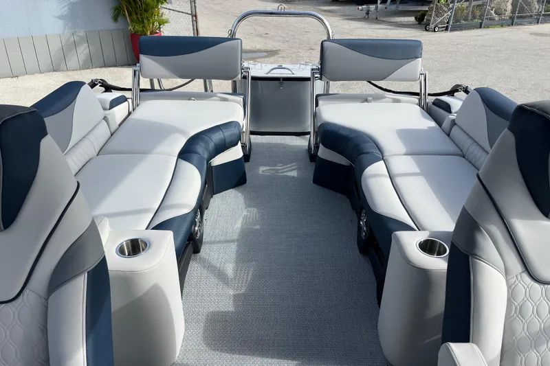 Slide: The Image of 2026 Avalon 2385 LSZ Quad Lounger interior with luxurious seating and cup holders. - 18
