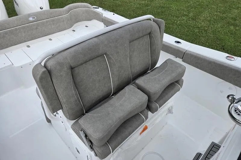 Slide: The Image of 2026 Sea Hunt Ultra 275 SE boat with gray cushioned seating. - 13