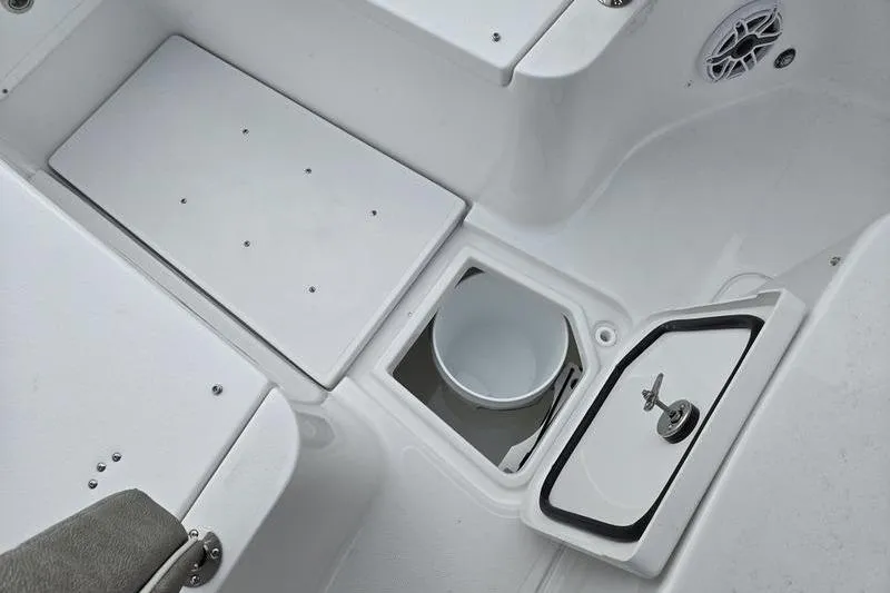 Slide: The Image of 2026 Sea Hunt Ultra 275 SE boat interior with storage compartments and seating. - 14