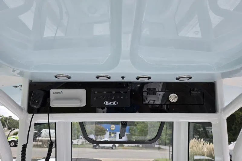 Slide: The Image of 2026 Sea Hunt Ultra 275 SE boat console with Garmin electronics and controls. - 17