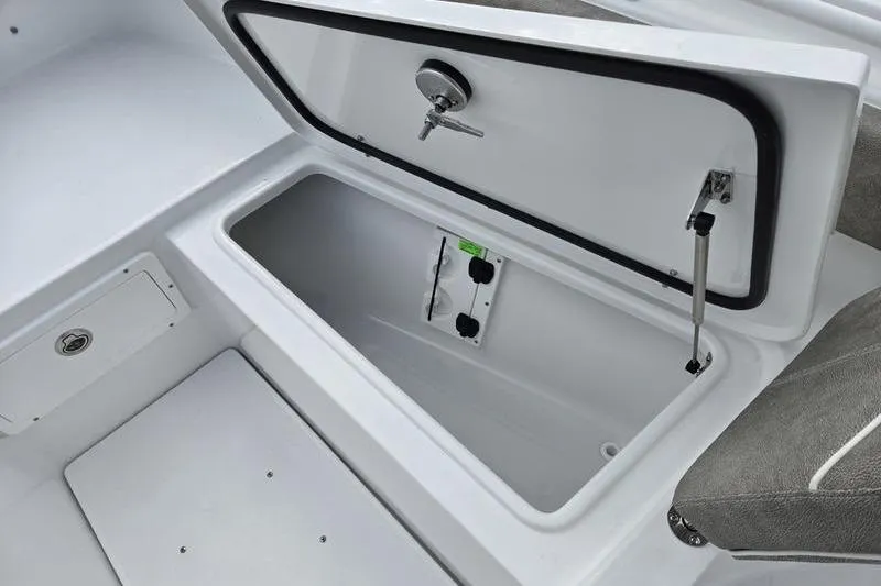 Slide: The Image of Open storage compartment on 2026 Sea Hunt Ultra 275 SE boat. - 19