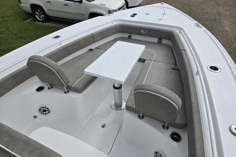 Slide: The Image of 2026 Sea Hunt Ultra 275 SE boat interior with seating and table setup. - 25