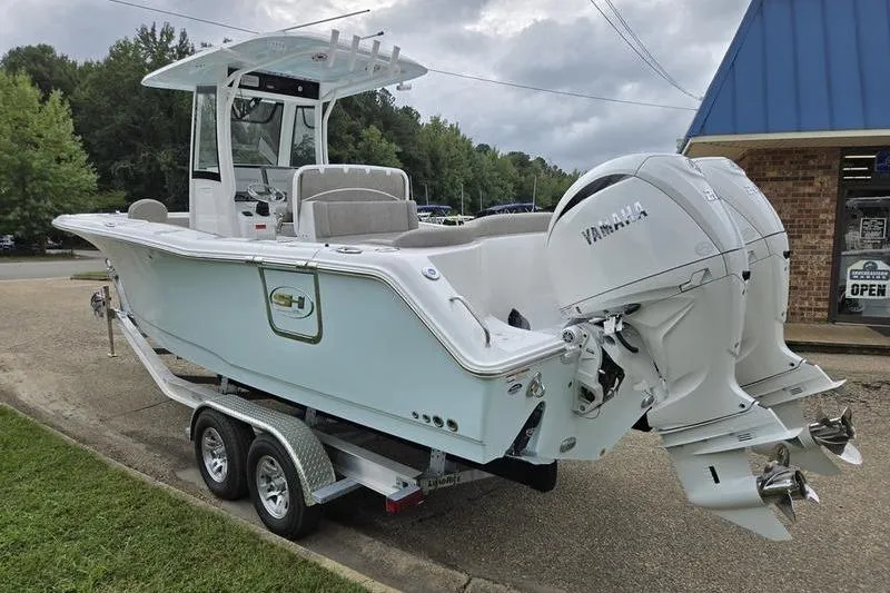 Slide: The Image of 2026 Sea Hunt Ultra 275 SE boat with dual Yamaha engines on a trailer. - 3