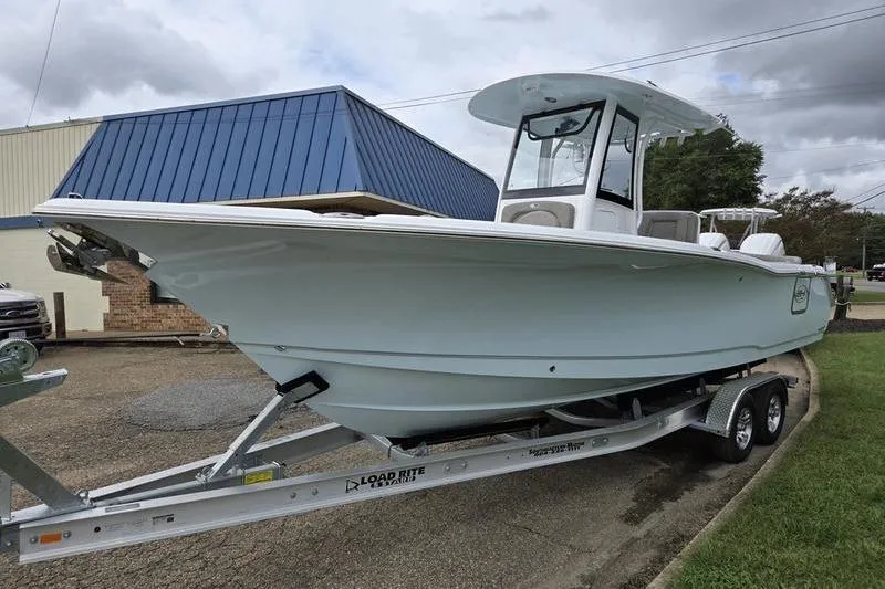 Slide: The Image of 2026 Sea Hunt Ultra 275 SE boat on trailer, parked outdoors. - 4