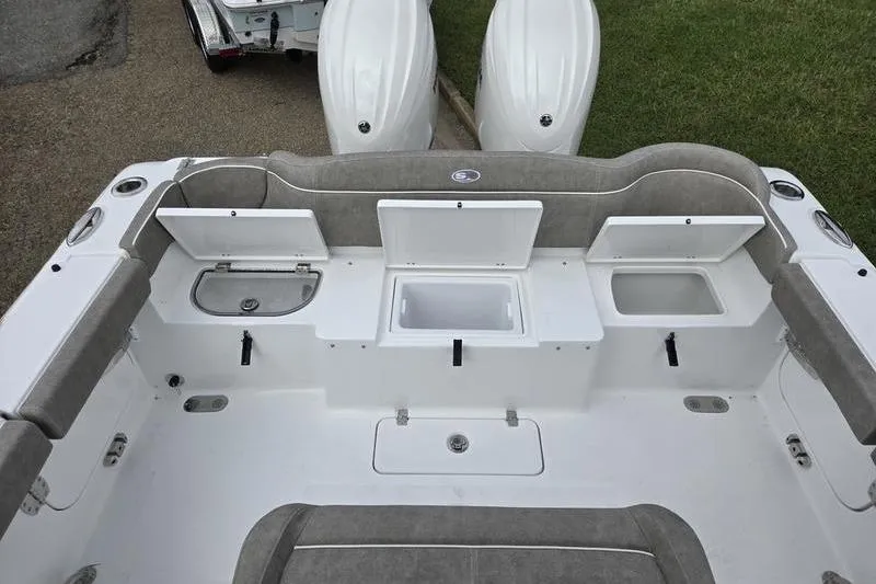 Slide: The Image of 2026 Sea Hunt Ultra 275 SE boat interior with storage compartments and seating. - 5