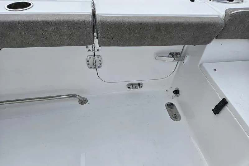 Slide: The Image of 2026 Sea Hunt Ultra 275 SE boat interior with seating and drainage features. - 7