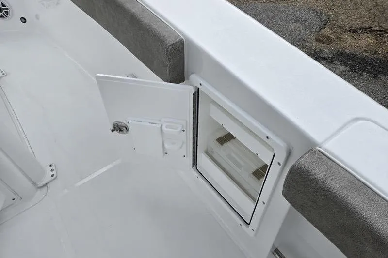 Slide: The Image of 2026 Sea Hunt Ultra 275 SE boat interior with open storage compartment. - 9