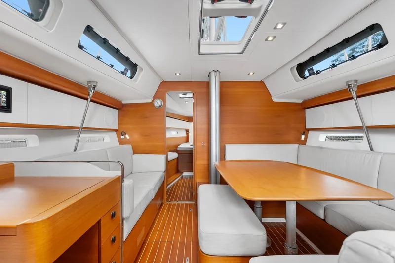 Slide: The Image of Luxurious interior of 2015 Italia Yachts 13.98, featuring elegant wood and white furnishings. - 26