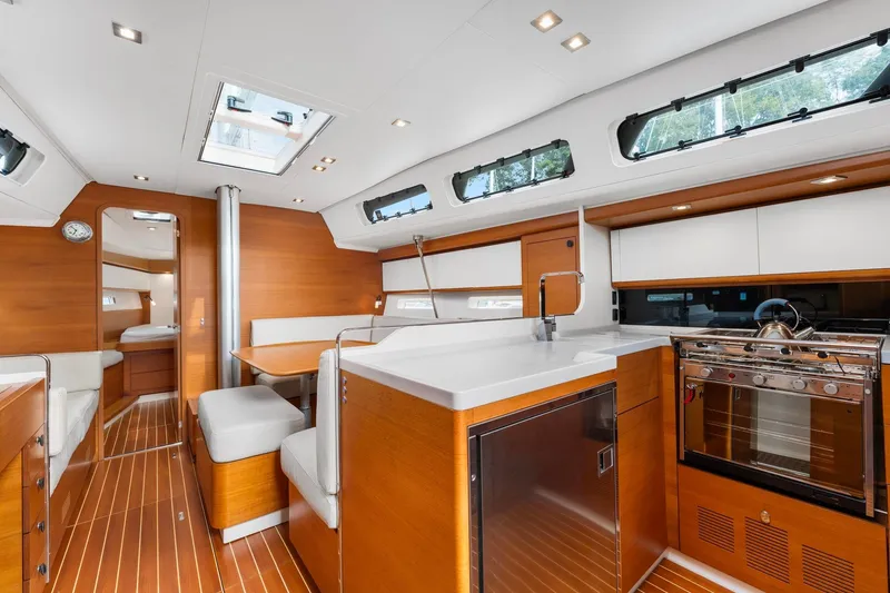 Slide: The Image of Luxurious interior of 2015 Italia Yachts 13.98, featuring modern kitchen and seating area. - 27