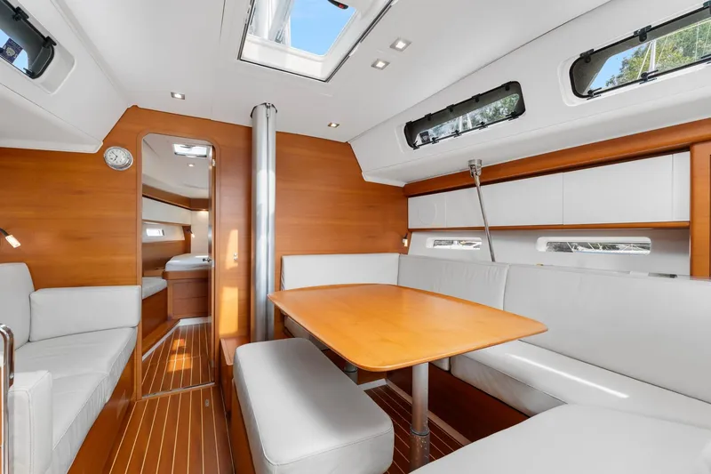 Slide: The Image of Luxurious interior of 2015 Italia Yachts 13.98, featuring elegant wood finishes and modern seating. - 30