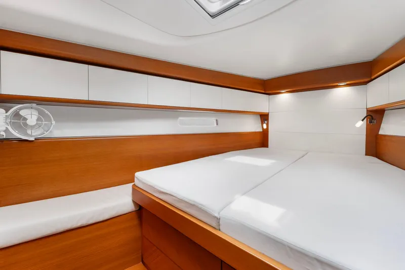 Slide: The Image of Luxurious cabin interior of 2015 Italia Yachts 13.98, featuring sleek wood finishes and modern design. - 34