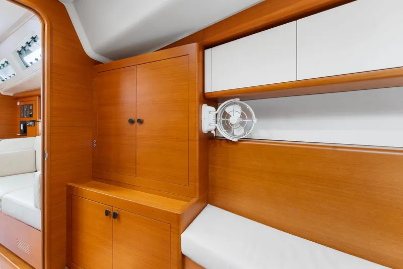 Slide: The Image of Interior of 2015 Italia Yachts 13.98 with wooden cabinetry and seating area. - 35