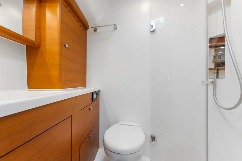 Slide: The Image of Luxurious 2015 Italia Yachts 13.98 bathroom with wooden cabinetry and modern fixtures. - 37